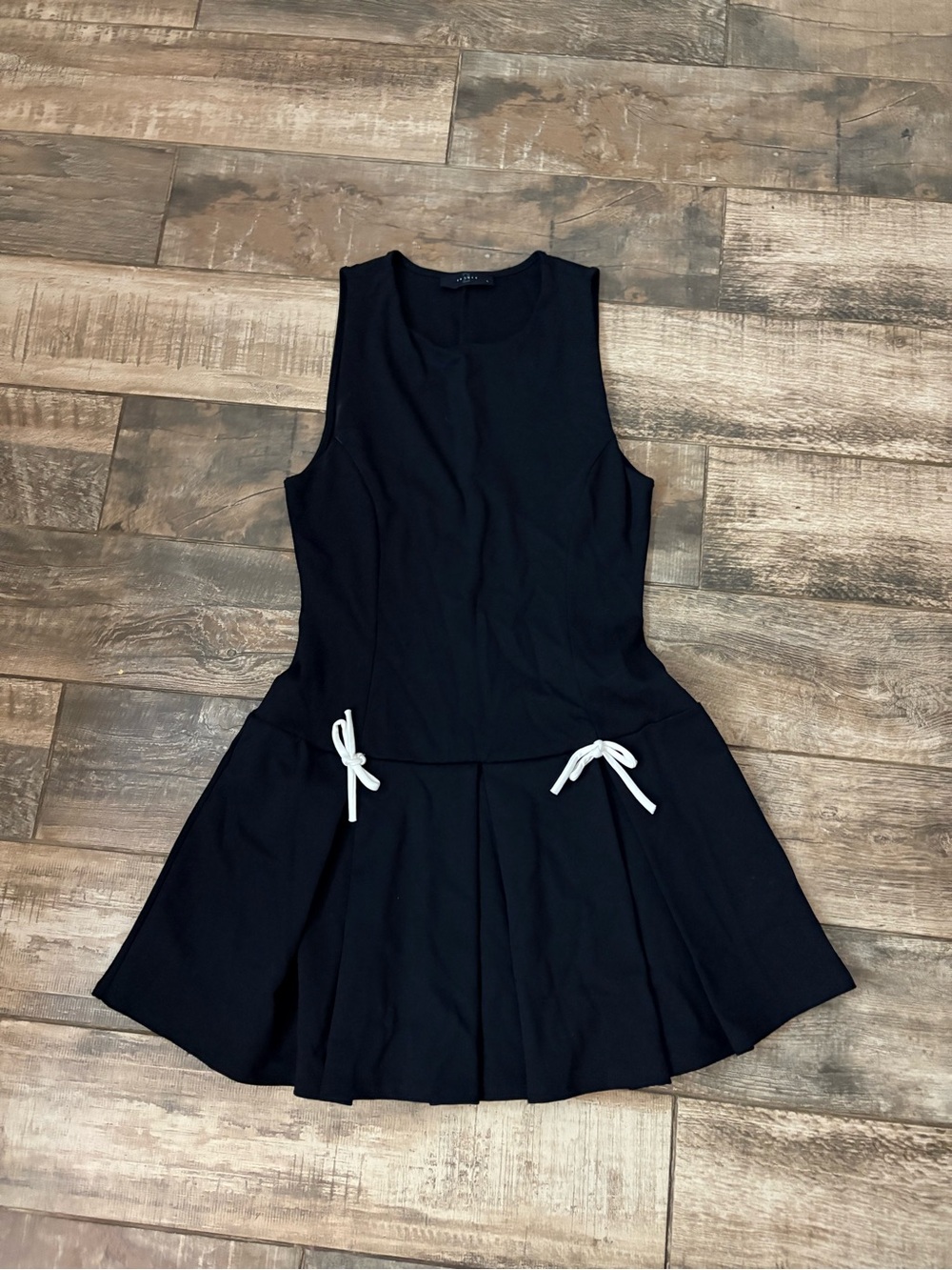 Black Sleeveless Pleated Dress with White Bow Accents